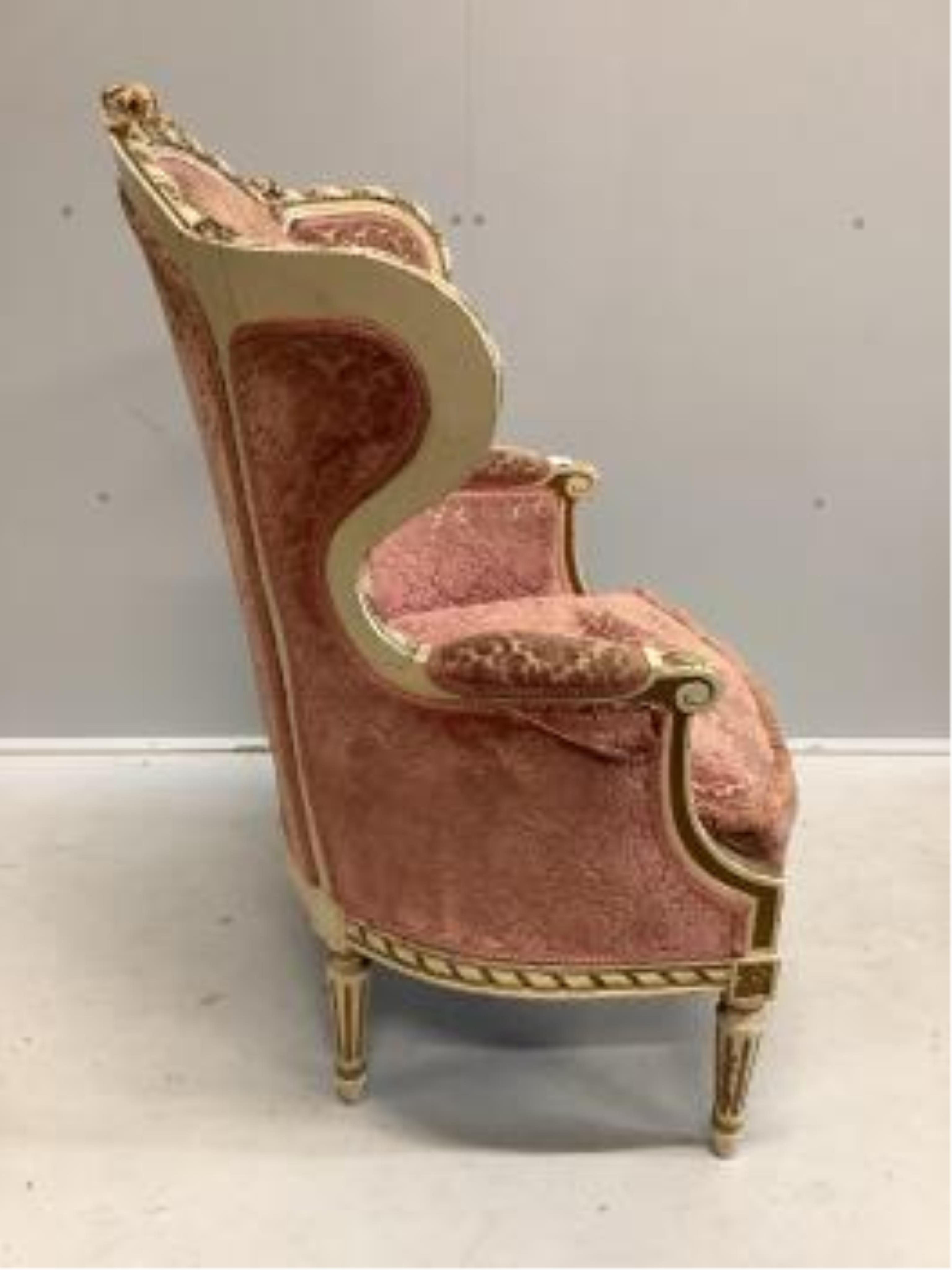 A Louis XVI style cream painted and gilt armchair and a gilt framed wall mirror, width 85cm, height 72cm. Condition - both poor